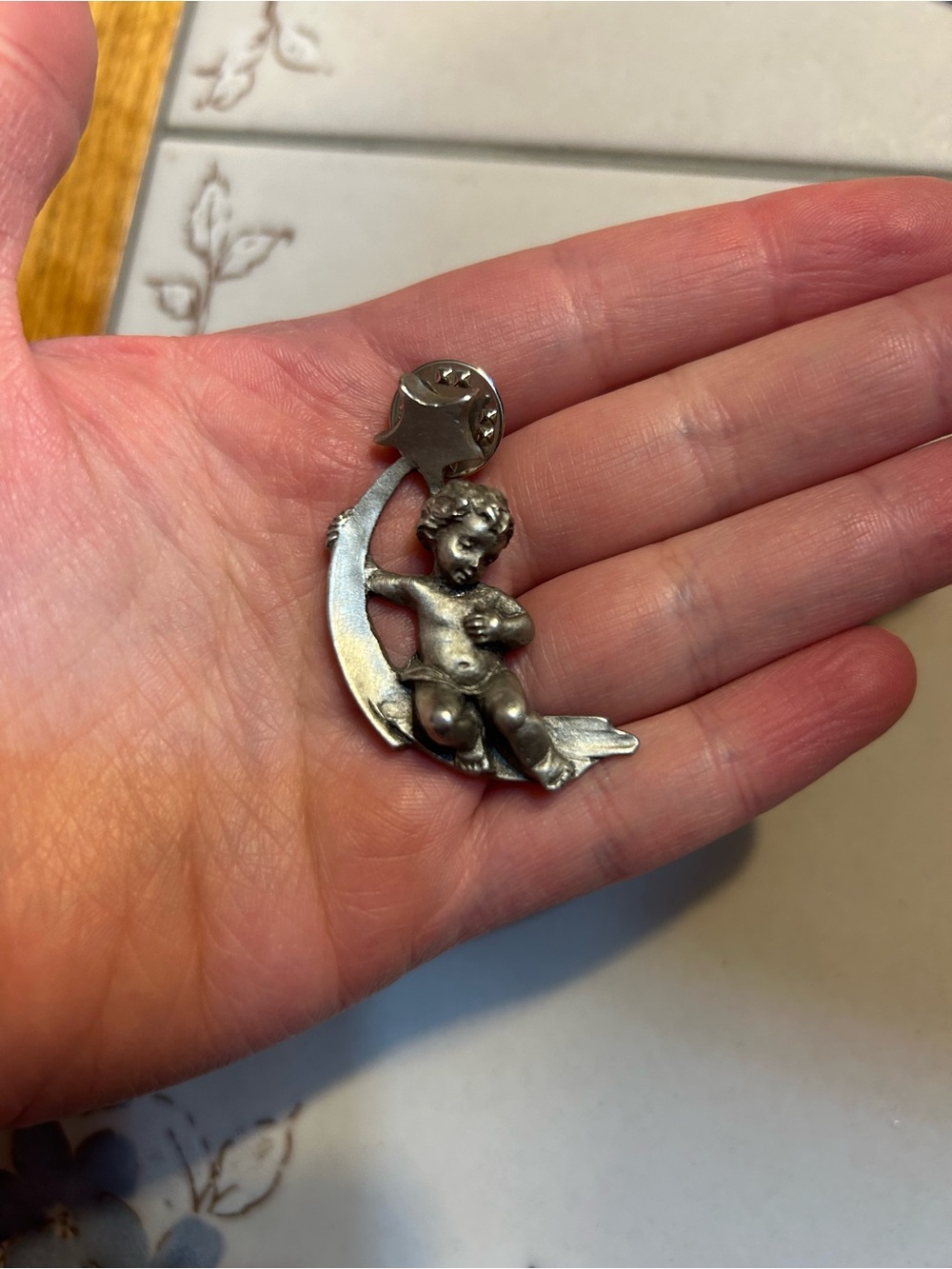 Vintage silver metal angel cherub on shooting star celestial pin